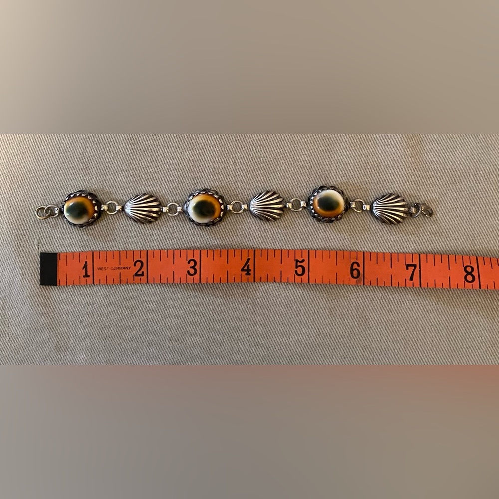 Vintage carved silver bracelet with cats eye shells